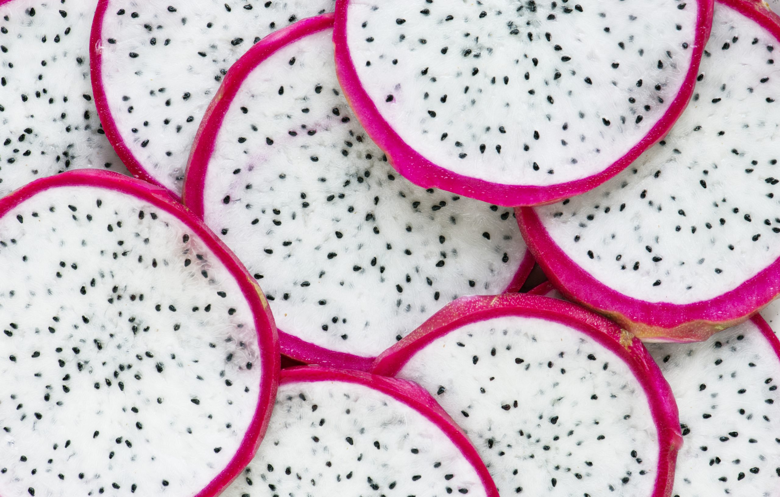 Closeup of dragon fruit slices background